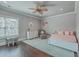 Serene bedroom with a ceiling fan, soft pink bedding, and a charming -sized table and chairs at 2040 Ashburton Way, Mount Pleasant, SC 29466