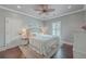 Inviting bedroom with neutral tones, a plush bed, and bright natural light from shuttered windows at 2040 Ashburton Way, Mount Pleasant, SC 29466