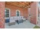 Covered patio with comfortable seating, perfect for outdoor relaxation and entertaining at 2040 Ashburton Way, Mount Pleasant, SC 29466
