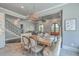 Cozy kitchen dining area featuring an exposed beam entryway and hardwood floors at 2040 Ashburton Way, Mount Pleasant, SC 29466