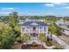 Stunning aerial view of a grand home with lush landscaping and waterfront access at 2040 Ashburton Way, Mount Pleasant, SC 29466