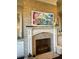 Close up of brick fireplace with mantel and painting at 2040 Ashburton Way, Mount Pleasant, SC 29466