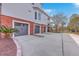 Attached three-car garage and driveway with mature landscaping at 2040 Ashburton Way, Mount Pleasant, SC 29466