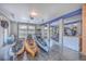 Three kayaks stored inside the spacious, multi-car garage with blue accents at 2040 Ashburton Way, Mount Pleasant, SC 29466