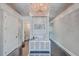 Elegant hallway with chandelier, sleek hardwood floors, and stylish decor at 2040 Ashburton Way, Mount Pleasant, SC 29466