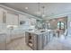 Spacious gourmet kitchen with a large island, stainless steel appliances, and pendant lighting at 2040 Ashburton Way, Mount Pleasant, SC 29466