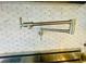 A sleek stainless steel pot filler is a stylish and useful addition to this modern kitchen at 2040 Ashburton Way, Mount Pleasant, SC 29466