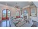 Elegant living room with fireplace, arched doors to balcony, and comfortable seating at 2040 Ashburton Way, Mount Pleasant, SC 29466