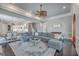 Open-concept living room with staircase, dining area, and large sectional sofa at 2040 Ashburton Way, Mount Pleasant, SC 29466