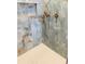 Modern shower with blue marble-patterned walls and a gold shower fixture at 2040 Ashburton Way, Mount Pleasant, SC 29466