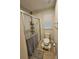 Cozy bathroom featuring a glass enclosed shower, toilet and tiled floors with natural light from window at 205 Grand Palm Ln, Summerville, SC 29485