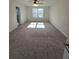 Spacious bedroom featuring neutral carpet and lots of natural light through a large window at 205 Grand Palm Ln, Summerville, SC 29485