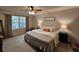 Inviting primary bedroom with a ceiling fan, large window, cozy décor, and plenty of space at 205 Grand Palm Ln, Summerville, SC 29485