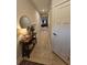 Inviting hallway with tile floors, decor, and a glimpse into the kitchen at 205 Grand Palm Ln, Summerville, SC 29485