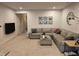 Comfortable living room featuring a large sectional sofa, TV, and neutral decor at 205 Grand Palm Ln, Summerville, SC 29485