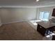 Spacious open concept living area with neutral carpet and lots of natural light through sliding glass doors at 205 Grand Palm Ln, Summerville, SC 29485