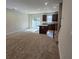 Open-concept space with a kitchen island, sliding glass doors, and cozy carpeted living room at 205 Grand Palm Ln, Summerville, SC 29485