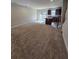Open-concept living space with a kitchen island, dining area, and sliding glass doors for lots of light at 205 Grand Palm Ln, Summerville, SC 29485