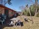 Backyard featuring a brick house, picnic table, and swing set on a grass-covered yard at 205 Longstreet St, Summerville, SC 29486
