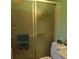 Bathroom featuring a shower with sliding glass door, commode, and a towel hanging on the rack at 205 Longstreet St, Summerville, SC 29486