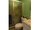 Compact bathroom featuring a toilet, sink with a mirrored sliding shower door at 205 Longstreet St, Summerville, SC 29486