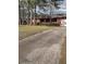 Charming single-story home with a well-manicured lawn and mature trees at 205 Longstreet St, Summerville, SC 29486