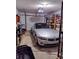 Spacious garage with convertible parked and organizational shelving at 205 Longstreet St, Summerville, SC 29486