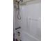 Bathroom shower with white tile walls and a shower head with mounted caddy for toiletries at 205 Longstreet St, Summerville, SC 29486
