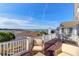 Outdoor back deck area featuring wicker chairs with scenic marsh views at 23 Lowndes Pointe Dr, Charleston, SC 29403