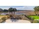 Expansive marsh view from backyard, complete with mature landscaping and palm trees at 23 Lowndes Pointe Dr, Charleston, SC 29403
