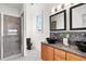 Stylish bathroom with double sinks, sleek fixtures, a tiled shower and a modern, minimalist design at 23 Lowndes Pointe Dr, Charleston, SC 29403