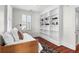 Comfortable bedroom featuring hardwood floors, built-in shelving, and natural light at 23 Lowndes Pointe Dr, Charleston, SC 29403