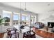 Dining room area with modern glass table and amazing water views through large windows at 23 Lowndes Pointe Dr, Charleston, SC 29403