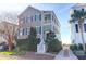 Charming two-story home with a spacious front porch and landscaped front yard at 23 Lowndes Pointe Dr, Charleston, SC 29403