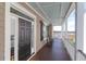 Welcoming front porch with cozy rocking chairs and scenic marsh views at 23 Lowndes Pointe Dr, Charleston, SC 29403