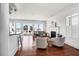 Bright and airy living room featuring hardwood floors, fireplace and scenic views at 23 Lowndes Pointe Dr, Charleston, SC 29403
