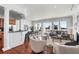 Bright, open living room and kitchen featuring hardwood floors and gorgeous water view at 23 Lowndes Pointe Dr, Charleston, SC 29403