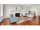 Inviting living room with hardwood floors, fireplace, and plush seating with a seamless flow to the kitchen at 23 Lowndes Pointe Dr, Charleston, SC 29403