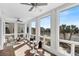 Relaxing sun room with stunning marsh views and comfortable seating at 23 Lowndes Pointe Dr, Charleston, SC 29403