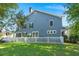 This home's backyard features a white picket fence, well-manicured lawn and mature trees at 2690 Park W Blvd, Mount Pleasant, SC 29466