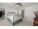 Cozy bedroom with a metal frame bed, carpet flooring, and a bathroom in the background at 2690 Park W Blvd, Mount Pleasant, SC 29466