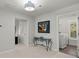 Hallway with a laundry room, door and an antique-style table at 2690 Park W Blvd, Mount Pleasant, SC 29466