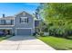 Well-maintained home with a two-car garage, neat lawn, mature palm trees, and a white picket fence at 2690 Park W Blvd, Mount Pleasant, SC 29466