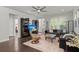 Spacious living room with hardwood floors, ceiling fan, and ample natural light, perfect for relaxation at 2690 Park W Blvd, Mount Pleasant, SC 29466