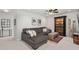 Inviting living room with a plush gray sectional, decorative pillows, and a stylish display cabinet at 2690 Park W Blvd, Mount Pleasant, SC 29466