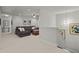 Second-floor living room with a plush sofa, ottoman and carpeted floors at 2690 Park W Blvd, Mount Pleasant, SC 29466