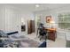 Functional office space with a desk, printer, and natural light from the windows at 2690 Park W Blvd, Mount Pleasant, SC 29466
