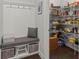 This home includes a large pantry, a bench with storage and coat hooks by the pantry at 2690 Park W Blvd, Mount Pleasant, SC 29466