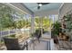Inviting screened porch with views of the professionally landscaped yard, perfect for outdoor entertaining at 2690 Park W Blvd, Mount Pleasant, SC 29466