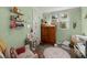 Charming bedroom with soft green walls, vintage furniture, and cozy textiles at 29 Wendy Lane, Charleston, SC 29407